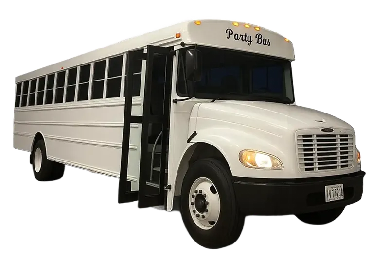 White party bus with open door, parked outdoors. 